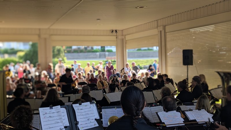 Community Concert Band with blurred audience