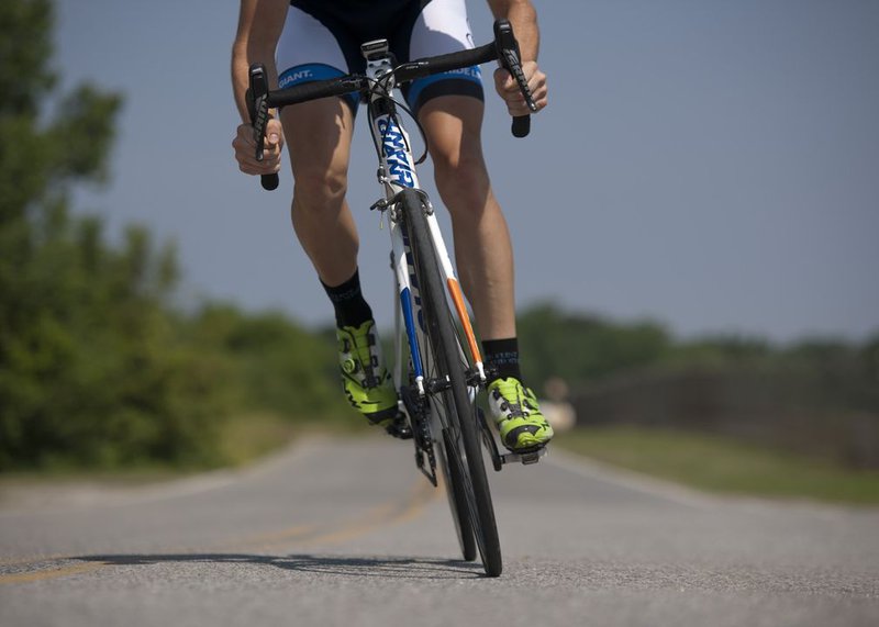 person-riding-road-bike-on-the-road-38296_web.jpg